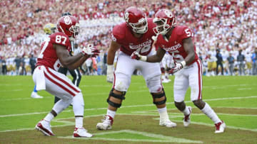 NORMAN, OK - SEPTEMBER 08: Wide receiver Myles Tease #87 and offensive lineman Cody Ford #74 celebrate the touchdown by wide receiver Marquise Brown #5 of the Oklahoma Sooners against the UCLA Bruins at Gaylord Family Oklahoma Memorial Stadium on September 8, 2018 in Norman, Oklahoma. (Photo by Brett Deering/Getty Images)