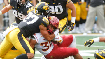 IOWA CITY, IOWA- SEPTEMBER 08: Runningback David Montgomery #32 of the Iowa State Cyclones is brought down during the first half by defensive back Amani Hooker #27of the Iowa Hawkeyes on September 8, 2018 at Kinnick Stadium, in Iowa City, Iowa. (Photo by Matthew Holst/Getty Images)
