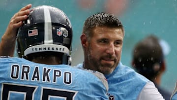 MIAMI, FL - SEPTEMBER 09: Head coach Mike Vrable of the Tennessee Titans greets Birian Orakpo prior to taking on the Miami Dolphins at Hard Rock Stadium on September 9, 2018 in Miami, Florida. (Photo by Marc Serota/Getty Images)