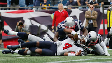 FOXBOROUGH, MA - SEPTEMBER 09: Deshaun Watson #4 of the Houston Texans is tackled by the New England Patriots defense during the second half at Gillette Stadium on September 9, 2018 in Foxborough, Massachusetts. (Photo by Jim Rogash/Getty Images)