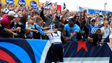 NASHVILLE, TN - SEPTEMBER 16: Taywan Taylor #13 of the Tennessee Titans jumps into the crowd after scoring a touchdown against the Houston Texans in the second quarter at Nissan Stadium on September 16, 2018 in Nashville, Tennessee. (Photo by Andy Lyons/Getty Images)