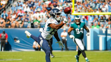 NASHVILLE, TN - SEPTEMBER 30: Corey Davis #84 of the Tennessee Titans attempts to catch a pass from Marcus Mariota #8 during the first quarter at Nissan Stadium on September 30, 2018 in Nashville, Tennessee. (Photo by Frederick Breedon/Getty Images)