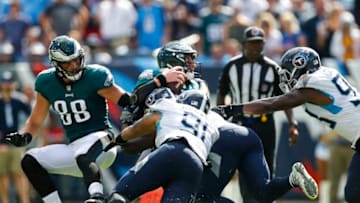 NASHVILLE, TN - SEPTEMBER 30: Carson Wentz #11 of the Philadelphia Eagles is sacked by Derrick Morgan #91 and Jayon Brown #55 of the Tennessee Titans during the fourth quarter at Nissan Stadium on September 30, 2018 in Nashville, Tennessee. (Photo by Wesley Hitt/Getty Images)