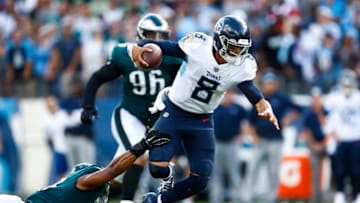 NASHVILLE, TN - SEPTEMBER 30: Marcus Mariota #8 of the Tennessee Titans is defended by Jordan Hicks #58 of the Philadelphia Eagles during overtime at Nissan Stadium on September 30, 2018 in Nashville, Tennessee. (Photo by Wesley Hitt/Getty Images)