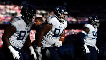 LONDON, ENGLAND - OCTOBER 21: Austin Johnson (94) of the Tennessee Titans warms up ahead of the Tennessee Titans against the Los Angeles Chargers at Wembley Stadium on October 21, 2018 in London, England. (Photo by Justin Setterfield/Getty Images)