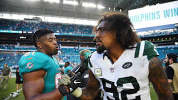 MIAMI, FL - NOVEMBER 04: Leonard Williams #92 of the New York Jets congratulates Cameron Wake #91 of the Miami Dolphins after the Dolphins defeated the Jets 13 to 6 in their game at Hard Rock Stadium on November 4, 2018 in Miami, Florida. (Photo by Mark Brown/Getty Images)