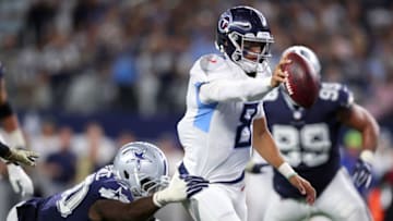 ARLINGTON, TX - NOVEMBER 05: Demarcus Lawrence #90 of the Dallas Cowboys grabs Marcus Mariota #8 of the Tennessee Titans who scores a touchdown in the fourth quarter at AT&T Stadium on November 5, 2018 in Arlington, Texas. (Photo by Tom Pennington/Getty Images)