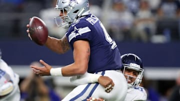 ARLINGTON, TX - NOVEMBER 05: Dak Prescott #4 of the Dallas Cowboys gets sacked by Harold Landry #58 of the Tennessee Titans in the fourth quarter of a football game at AT&T Stadium on November 5, 2018 in Arlington, Texas. (Photo by Tom Pennington/Getty Images)