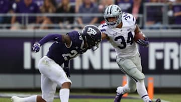 FORT WORTH, TEXAS - NOVEMBER 03: Alex Barnes #34 of the Kansas State Wildcats runs the ball against Vernon Scott #26 of the TCU Horned Frogs at Amon G. Carter Stadium on November 03, 2018 in Fort Worth, Texas. (Photo by Ronald Martinez/Getty Images)