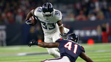 HOUSTON, TX - NOVEMBER 26: Dion Lewis #33 of the Tennessee Titans rushes the ball in the first quarter defended by Zach Cunningham #41 of the Houston Texans at NRG Stadium on November 26, 2018 in Houston, Texas. (Photo by Tim Warner/Getty Images)