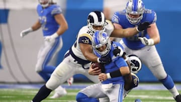 DETROIT, MI - DECEMBER 02: Quarterback Matthew Stafford #9 of the Detroit Lions is sacked by Ndamukong Suh #93 of the Los Angeles Rams and Dante Fowler #56 during the first half at Ford Field on December 2, 2018 in Detroit, Michigan. (Photo by Gregory Shamus/Getty Images)
