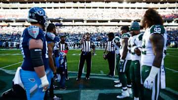 NASHVILLE, TN - DECEMBER 2: Referee Jerome Boger carries out the coin toss before the Tennessee Titans play the New York Jets at Nissan Stadium on December 2, 2018 in Nashville, Tennessee. (Photo by Frederick Breedon/Getty Images)