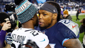 NASHVILLE, TN - DECEMBER 6: Derrick Henry #22 of the Tennessee Titans hugs T.J. Yeldon #24 of the Jacksonville Jaguars after the game at Nissan Stadium on December 6, 2018 in Nashville, Tennessee. (Photo by Wesley Hitt/Getty Images)