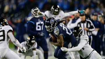 NASHVILLE, TN - DECEMBER 6: Derrick Henry #22 of the Tennessee Titans runs with the ball while being tackled by Myles Jack #44 of the Jacksonville Jaguars during the fourth quarter at Nissan Stadium on December 6, 2018 in Nashville, Tennessee. (Photo by Silas Walker/Getty Images)