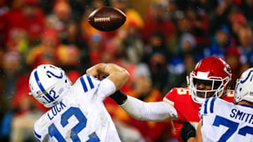 KANSAS CITY, MO - JANUARY 12: Outside linebacker Dee Ford #55 of the Kansas City Chiefs jars the football out of the hand of quarterback Andrew Luck #12 of the Indianapolis Colts during the AFC Divisional Playoff at Arrowhead Stadium on January 12, 2019 in Kansas City, Missouri. The Chiefs won, 31-13. (Photo by David Eulitt/Getty Images)