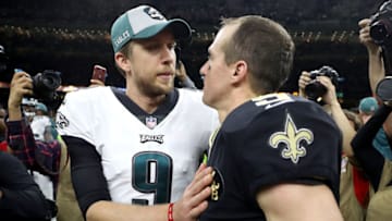 NEW ORLEANS, LOUISIANA - JANUARY 13: Nick Foles #9 of the Philadelphia Eagles (L) meets with Drew Brees #9 of the New Orleans Saints at mid-field after his teams loss in the NFC Divisional Playoff Game at Mercedes Benz Superdome on January 13, 2019 in New Orleans, Louisiana. The Saints defeated the Eagles 20-14. (Photo by Chris Graythen/Getty Images)