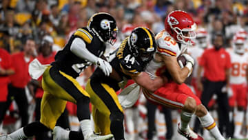 PITTSBURGH, PA - AUGUST 17: Cody Thompson #83 of the Kansas City Chiefs is wrappped up for a tackle by Tyler Matakevich #44 of the Pittsburgh Steelers in the first half during a preseason game at Heinz Field on August 17, 2019 in Pittsburgh, Pennsylvania. (Photo by Justin Berl/Getty Images)