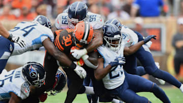 CLEVELAND, OH - SEPTEMBER 08: D'Ernest Johnson #30 of the Cleveland Browns is smothered by the Tennessee Titans defense after catching a pass in the third quarter at FirstEnergy Stadium on September 08, 2019 in Cleveland, Ohio . (Photo by Jamie Sabau/Getty Images)