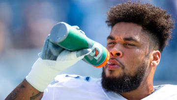 NASHVILLE, TN - SEPTEMBER 15: Jamil Douglas #75 of the Tennessee Titans drinks water before the game against the Indianapolis Colts at Nissan Stadium on September 15, 2019 in Nashville, Tennessee. (Photo by Brett Carlsen/Getty Images)