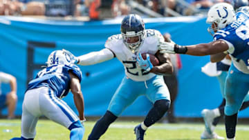 NASHVILLE, TN - SEPTEMBER 15: Derrick Henry #22 of the Tennessee Titans runs the ball and stiff arms Rock Ya-SIn #34 of the Indianapolis Colts at Nissan Stadium on September 15, 2019 in Nashville,Tennessee. The Colts defeated the Titans 19-17. (Photo by Wesley Hitt/Getty Images)