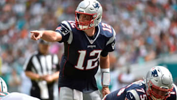 MIAMI, FL - SEPTEMBER 15: Tom Brady #12 of the New England Patriots points to the defense during the third quarter of the game against the Miami Dolphins at Hard Rock Stadium on September 15, 2019 in Miami, Florida. (Photo by Eric Espada/Getty Images)