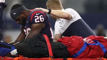 ARLINGTON, TEXAS - AUGUST 24: Lamar Miller #26 of the Houston Texans leaves the game after an injury in the first quarter during a NFL preseason game against the Dallas Cowboys at AT&T Stadium on August 24, 2019 in Arlington, Texas. (Photo by Ronald Martinez/Getty Images)