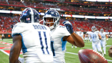 ATLANTA, GA - SEPTEMBER 29: A.J. Brown #11 and Jonnu Smith #81 of the Tennessee Titans celebrate after Brown scored a touchdown in the first half of an NFL game against the Atlanta Falcons at Mercedes-Benz Stadium on September 29, 2019 in Atlanta, Georgia. (Photo by Todd Kirkland/Getty Images)