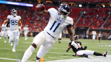 ATLANTA, GA - SEPTEMBER 29: A.J. Brown #11 of the Tennessee Titans rushes in for a touchdown after the reception in the first half of an NFL game against the Atlanta Falcons at Mercedes-Benz Stadium on September 29, 2019 in Atlanta, Georgia. (Photo by Todd Kirkland/Getty Images)