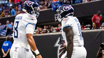 ATLANTA, GA - SEPTEMBER 29: A.J. Brown #11 celebrates with Marcus Mariota #8 of the Tennessee Titans after making a reception for a touchdown during the first half of a game at Mercedes-Benz Stadium on September 29, 2019 in Atlanta, Georgia. (Photo by Carmen Mandato/Getty Images)