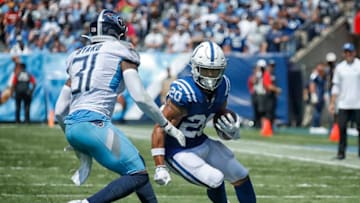 NASHVILLE, TENNESSEE - SEPTEMBER 15: Jordan Wilkins #20 of the Indianapolis Colts rushes against Kevin Byard #31 of the Tennessee Titans during the first half at Nissan Stadium on September 15, 2019 in Nashville, Tennessee. (Photo by Frederick Breedon/Getty Images)