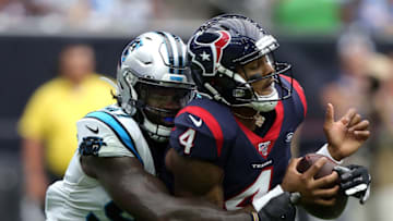 HOUSTON, TEXAS - SEPTEMBER 29: Deshaun Watson #4 of the Houston Texans is sacked by Mario Addison #97 of the Carolina Panthers during the first half at NRG Stadium on September 29, 2019 in Houston, Texas. (Photo by Bob Levey/Getty Images)