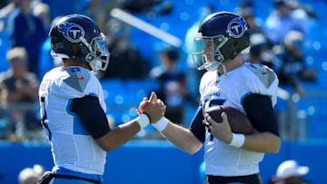 CHARLOTTE, NORTH CAROLINA - NOVEMBER 03: (L-R) Marcus Mariota #8 talks to teammate Ryan Tannehill #17 of the Tennessee Titans before their game against the Carolina Panthers at Bank of America Stadium on November 03, 2019 in Charlotte, North Carolina. (Photo by Streeter Lecka/Getty Images)