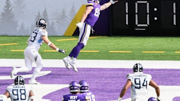 MINNEAPOLIS, MINNESOTA - SEPTEMBER 27: Kyle Rudolph #82 of the Minnesota Vikings makes a catch for a touchdown against Will Compton #53 of the Tennessee Titans during the fourth quarter of the game at U.S. Bank Stadium on September 27, 2020 in Minneapolis, Minnesota. (Photo by Hannah Foslien/Getty Images)