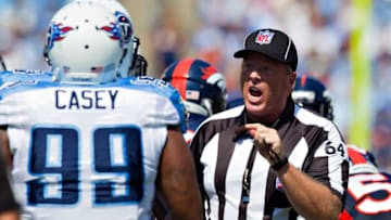 NASHVILLE, TN - SEPTEMBER 25: Umpire Dan Ferrell has a talk with Jurrell Casey