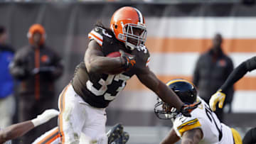 CLEVELAND, OH - NOVEMBER 25: Running back Trent Richardson #33 of the Cleveland Browns scores a touchdown as he runs by safety Ryan Clark #25 of the Pittsburgh Steelers at Cleveland Browns Stadium on November 25, 2012 in Cleveland, Ohio. (Photo by Matt Sullivan/Getty Images)