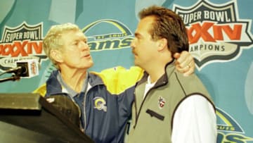 F363722 56: (NORTH AND SOUTH AMERICA SALES ONLY) St. Louis Rams head coach Dick Vermeil, left, shakes hands with Tennessee Titans head coach Jeff Fisher, right, after Super Bowl XXXIV between the Rams and Titans at the Georgia Dome in Atlanta, Georgia, January 30, 2000. The Rams defeated the Titans 23-16. (Photo by Andy Lyons)