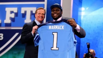 NEW YORK, NY - APRIL 25: Chance Warmack of the Alabama Crimson Tide stands on stage with NFL Commissioner Roger Goodell (L) as they hold up a jersey on stage after he was picked