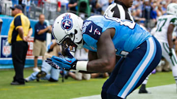 NASHVILLE, TN - SEPTEMBER 29: Delanie Walker #82 of the Tennessee Titans bows to the fans after scoring a touchdown against the New York Jets at LP Field on September 29, 2013 in Nashville, Tennessee. The Titans defeated the Jets 38-13. (Photo by Wesley Hitt/Getty Images)