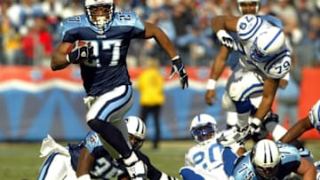 NASHVILLE,TN - DECEMBER 7: Eddie George #27 of the Tennessee Titans runs with the ball against the Indianapolis Colts during the Colts 29-27 victory on December 7, 2003 at The Coliseum in Nashville, Tennessee. (Photo by Andy Lyons/Getty Images)