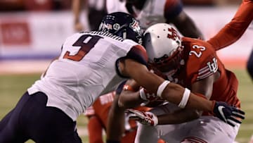 SALT LAKE CITY, UT - OCTOBER 8: Armand Shyne #23 of the Utah Utes is injured during a third quarter tackle by Dane Cruikshank #9 of the Arizona Wildcats at Rice-Eccles Stadium on October 8, 2016 in Salt Lake City, Utah. The Utes beat the Wildcats 36-23. (Photo by Gene Sweeney Jr/Getty Images)