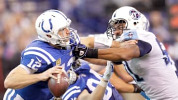 INDIANAPOLIS, IN - NOVEMBER 20: Andrew Luck #12 of the Indianapolis Colts is sacked by Derrick Morgan #91 of the Tennessee Titans during the second half of the game at Lucas Oil Stadium on November 20, 2016 in Indianapolis, Indiana. (Photo by Andy Lyons/Getty Images)