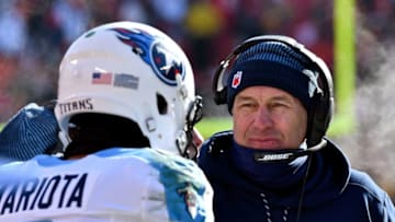 KANSAS CITY, MO - DECEMBER 18: Head coach Mike Mularkey of the Tennessee Titans talks with quarterback Marcus Mariota
