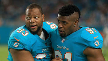 MIAMI GARDENS, FL - AUGUST 17: Ndamukong Suh #93 and Cameron Wake #91 of the Miami Dolphins talk during a preseason game against the Baltimore Ravens at Hard Rock Stadium on August 17, 2017 in Miami Gardens, Florida. (Photo by Mike Ehrmann/Getty Images)