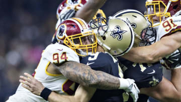 NEW ORLEANS, LA - NOVEMBER 19: Preston Smith #94 of the Washington Redskins hits Drew Brees #9 of the New Orleans Saints and is called for a roughing the passer penalty at Mercedes-Benz Superdome on November 19, 2017 in New Orleans, Louisiana. (Photo by Wesley Hitt/Getty Images)