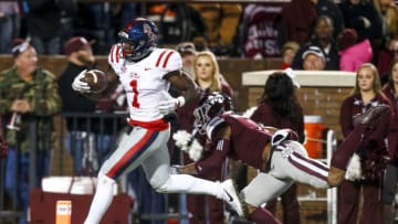 STARKVILLE, MS - NOVEMBER 23: A.J. Brown #1 of the Mississippi Rebels scores a touchdown as Brandon Bryant #1 of the Mississippi State Bulldogs tries to defend during the second half of an NCAA football game at Davis Wade Stadium on November 23, 2017 in Starkville, Mississippi. (Photo by Butch Dill/Getty Images)