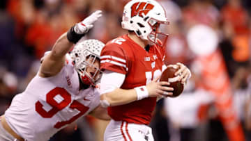 INDIANAPOLIS, IN - DECEMBER 02: Alex Hornibrook #12 of the Wisconsin Badgers is sacked by Nick Bosa #97 of the Ohio State Buckeyes in the Big Ten Championship at Lucas Oil Stadium on December 2, 2017 in Indianapolis, Indiana. (Photo by Andy Lyons/Getty Images)