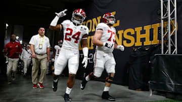 ATLANTA, GA - JANUARY 08: Brian Robinson Jr. #24 of the Alabama Crimson Tide walks out of the tunnel during warm ups with Jonah Williams #73 during warm ups prior to the game against the Georgia Bulldogs in the CFP National Championship presented by AT&T at Mercedes-Benz Stadium on January 8, 2018 in Atlanta, Georgia. (Photo by Jamie Squire/Getty Images)