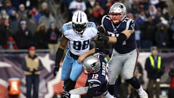 FOXBOROUGH, MA - JANUARY 13: Tom Brady #12 of the New England Patriots is tackled by Brian Orakpo #98 of the Tennessee Titans during the fourth quarter in the AFC Divisional Playoff game at Gillette Stadium on January 13, 2018 in Foxborough, Massachusetts. (Photo by Jim Rogash/Getty Images)