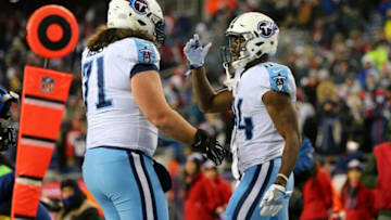 FOXBOROUGH, MA - JANUARY 13: Corey Davis #84 of the Tennessee Titans reacts with Dennis Kelly #71 after catching a touchdown pass during the fourth quarter against the New England Patriots in the AFC Divisional Playoff game at Gillette Stadium on January 13, 2018 in Foxborough, Massachusetts. (Photo by Adam Glanzman/Getty Images)