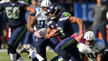 SEATTLE, WA. - OCTOBER 13: Quarterback Russell Wilson #3 of the Seattle Seahawks runs with the ball during the first quarter of the game against the Tennessee Titans at CenturyLink Field on October 13, 2013 in Seattle, Washington. (Photo by Steve Dykes/Getty Images)